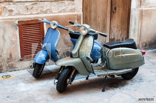 Picture of Two vintage scooter parked in the street